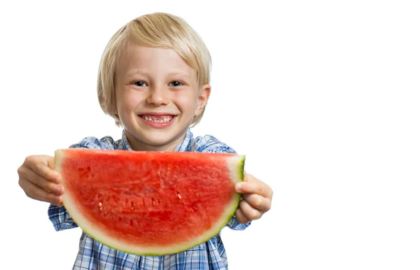 Smiling boy holding out slice of water melon — Stock Photo, Image
