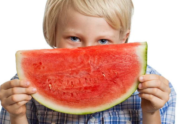 Šťastné usměvavý chlapec s plátkem melounu. — Stock fotografie