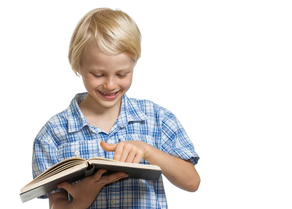 Garçon souriant tenant le livre et pointant Photo De Stock