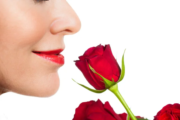 Close-up woman smelling a rose — Stock Photo, Image