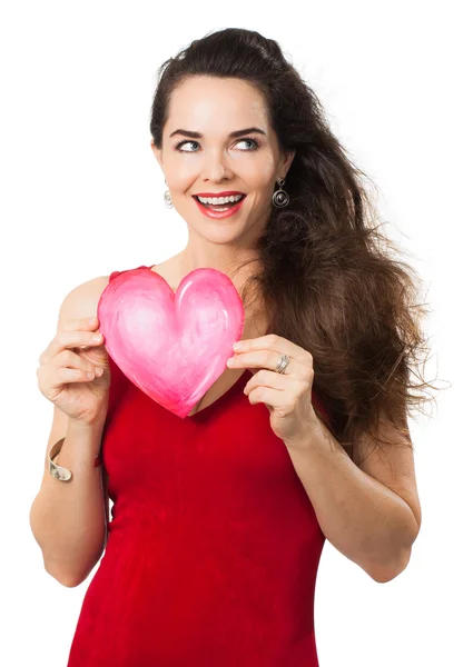 Femme souriante tenant coeur d'amour rouge . Images De Stock Libres De Droits