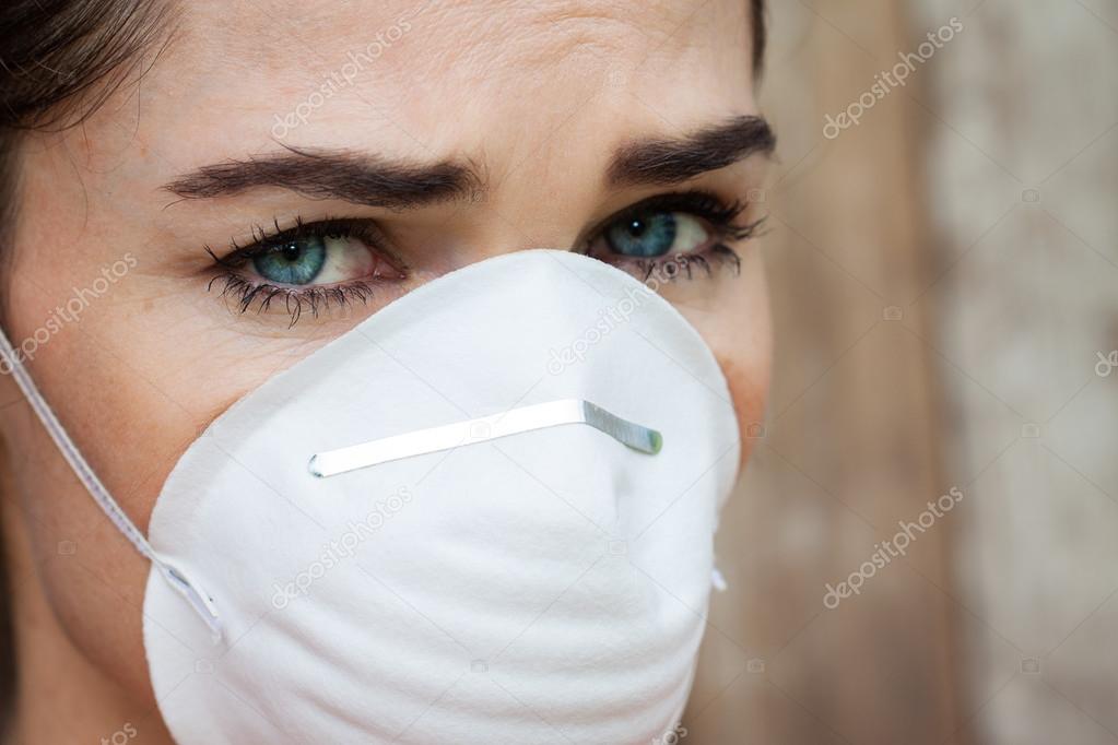 Close-up of concerned woman wearing a face mask