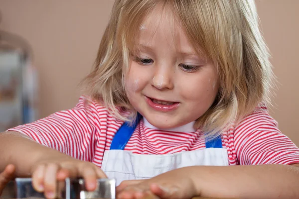 Close-up of boy making gingerbread cookie — Stock Photo, Image