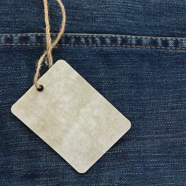 Price tag over jeans — Stock Photo, Image