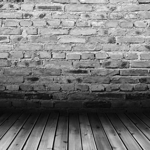 Boy drömmer om abstrakta redskapれんが造りの壁と木製の床 — ストック写真