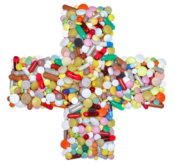 Medizinisches Kreuz aus Pillen, Kapseln und Tabletten Stockbild
