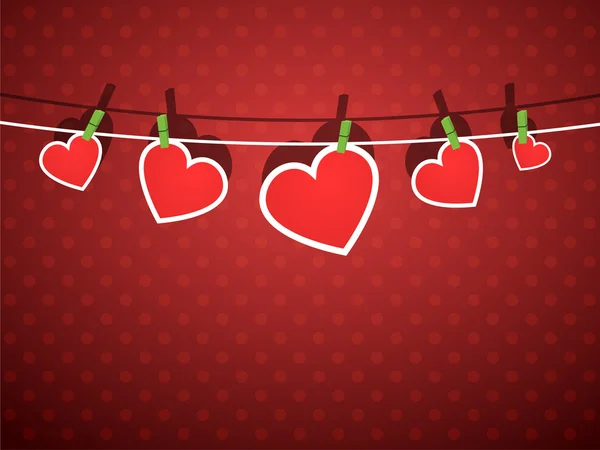 Papper hjärtan hängande från ett rep, på röd bakgrund. — Stock vektor