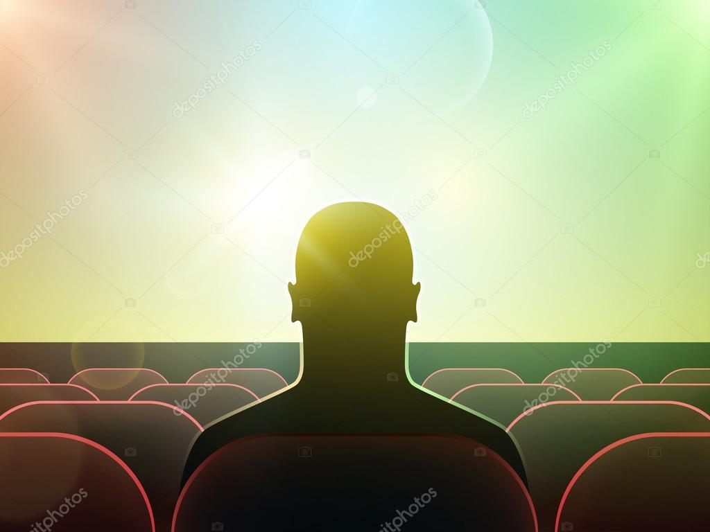 Man silhouette watching movie on big screen in cinema.