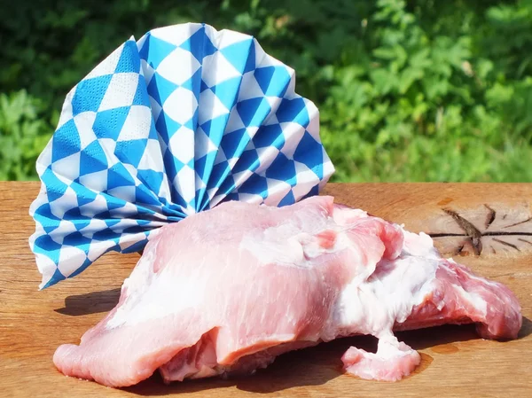 Raw pork with fat on a wooden board — Stock Photo, Image