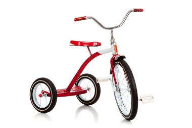 A red toy tricycle on a white background with copy space clipart