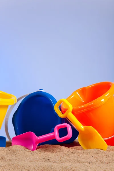 Row of colorful beach buckets or pails — Stock Photo, Image