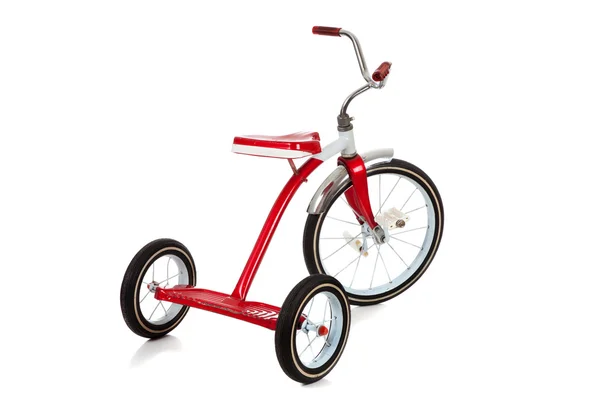 Червоний трицикл на білому — стокове фото