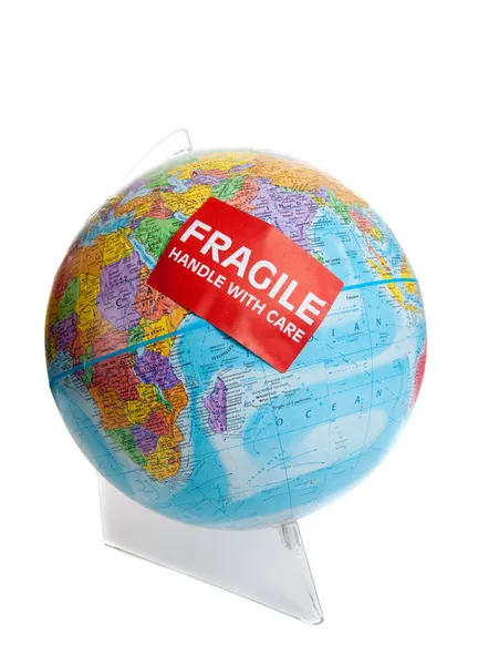 Earth globe with a fragile sticker — Stock Photo, Image