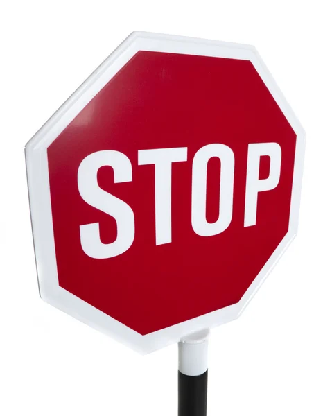 Um sinal vermelho de "stop" em um fundo branco — Fotografia de Stock