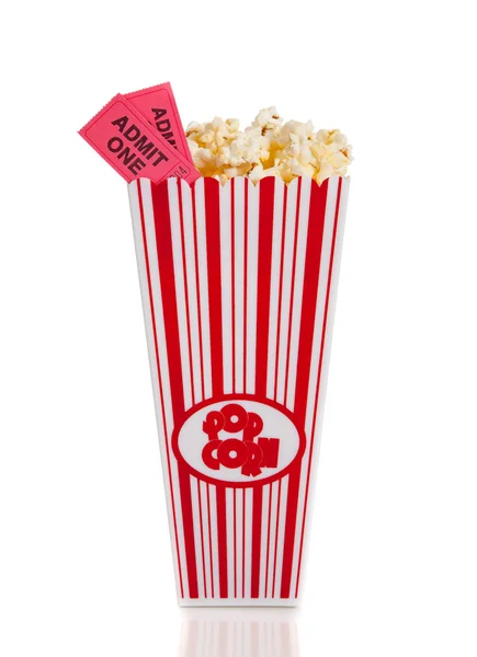 Container of movie popcorn with tickets — Stock Photo, Image