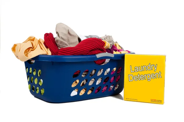 Overflowing laundry Basket with detergent - Household Chores — Stock Photo, Image