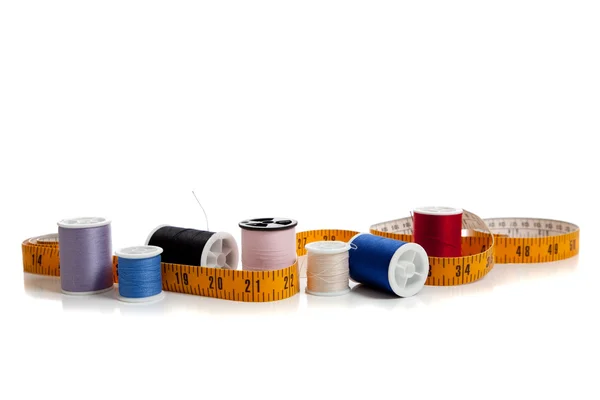Multi colored thread with tape measure — Stock Photo, Image