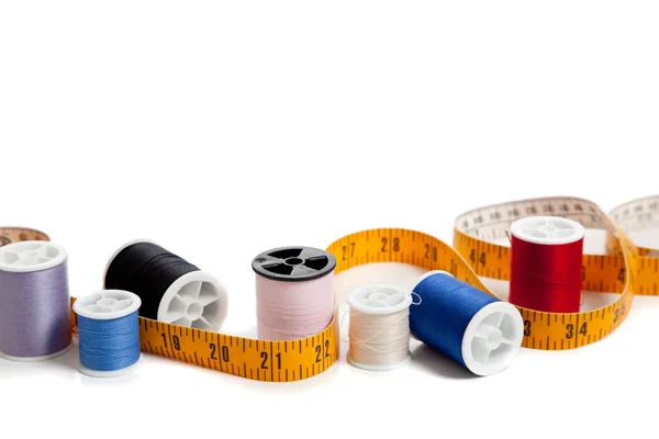 Multi colored thread with tape measure — Stock Photo, Image