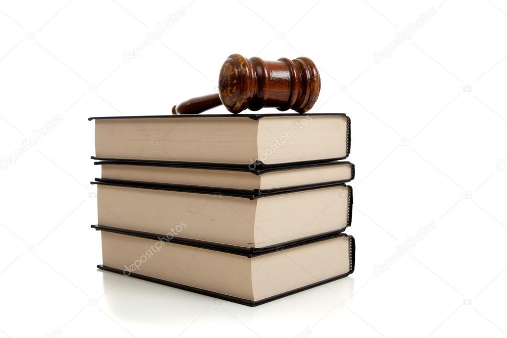 Wooden gavel on top of a stack of law books