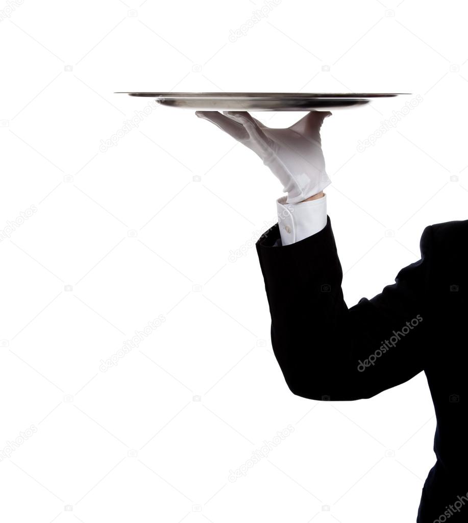 A butler's gloved hand holding a silver tray