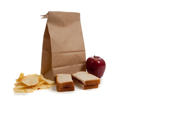 A Sack lunch with peanut butter sandwich — Stock Photo, Image