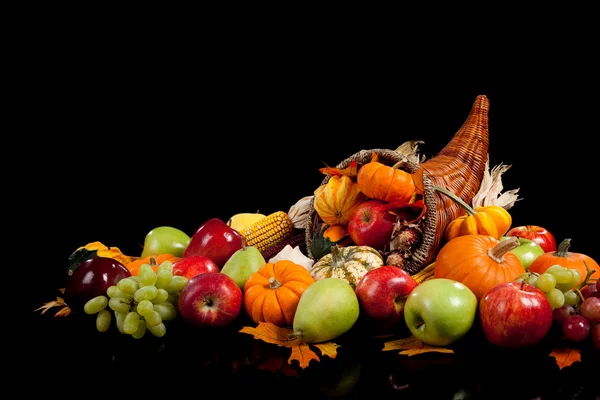 Fall arrangement of fruits and vegetables in a cornucopia — Stock Photo, Image