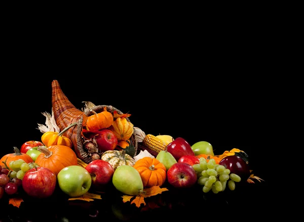Fall arrangement of fruits and vegetables in a cornucopia — Stock Photo, Image