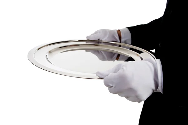 Ein Butler hält ein silbernes Tablett auf weiß — Stockfoto