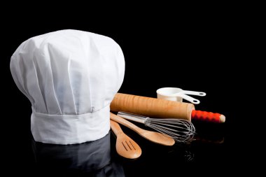 Toque with cooking utensils clipart