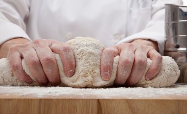 Hands kneading bread dough clipart