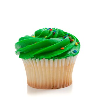 Yeşil kekin üzerine beyaz çikolata ile