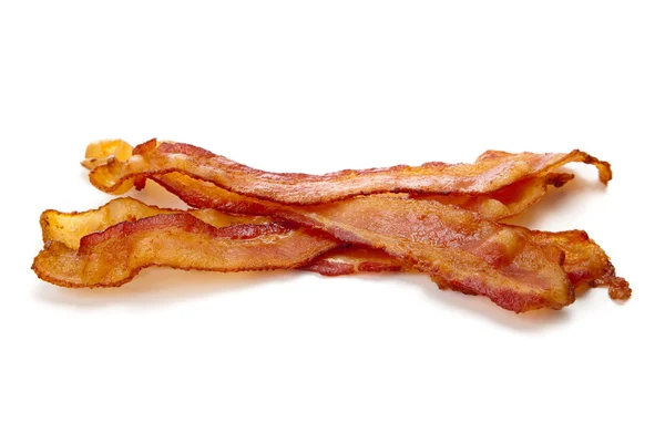 Slices of bacon on white — Stock Photo, Image