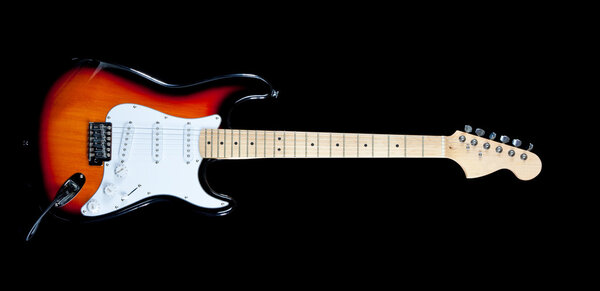 An electric guitar on a white background