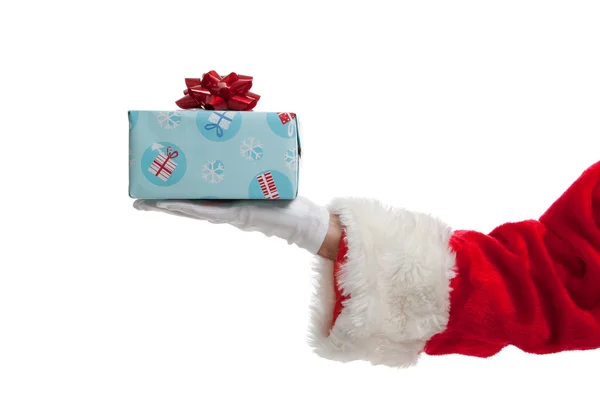 Санта дарит рождественские подарки на белом фоне — стоковое фото