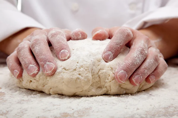 Hands kneading bread dough — Stock Photo, Image