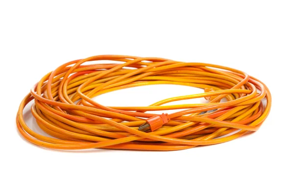 Um cabo de extensão laranja no branco — Fotografia de Stock