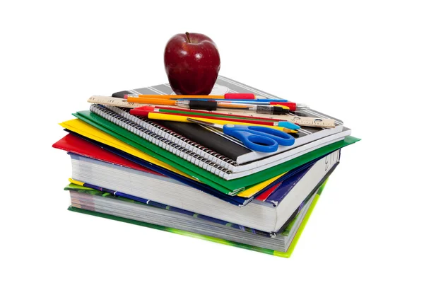 Stack of textbooks with school supplies on top — Stock Photo, Image