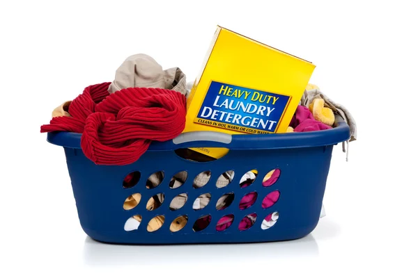 Blue laundry basket full of dirty clothes — Stock Photo, Image