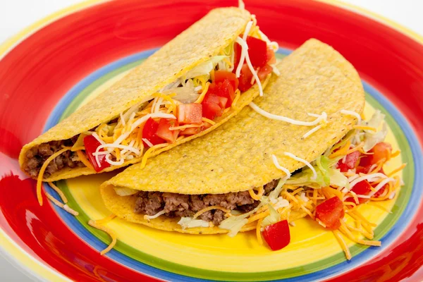 Two tacos on a red plate — Stock Photo, Image