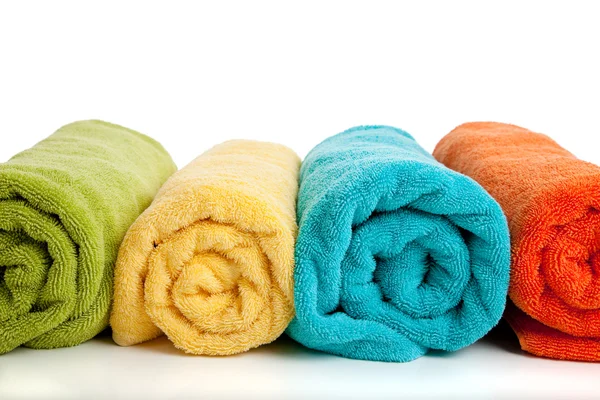 Assorted colored towels on white — Stock Photo, Image