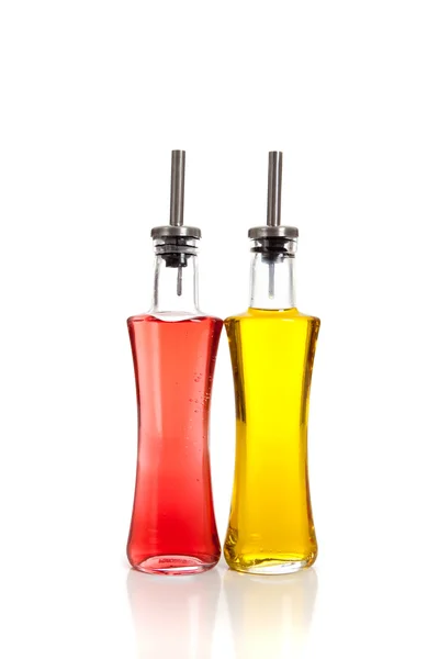 Glass containers of vinegar and oil on white — Stock Photo, Image