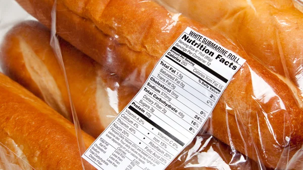 Nutrition label on loaves of french bread — Stock Photo, Image