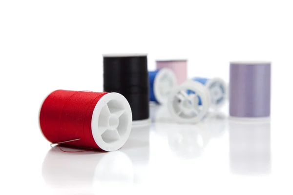 Assorted spools of thread on a white background — Stock Photo, Image