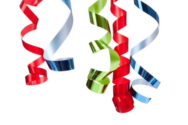 Curly ribbon hanging in front of white — Stock Photo, Image