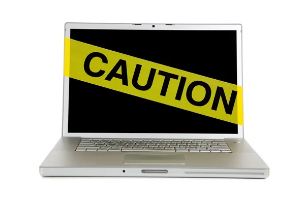 Yellow caution tape on a computer screen — Stock Photo, Image