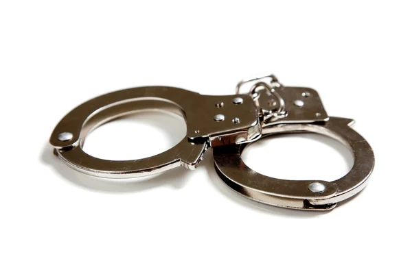 A set of handcuffs on white — Stock Photo, Image