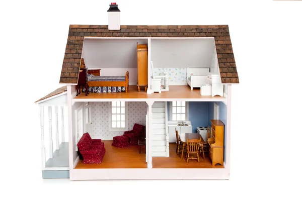 Barns dockhus med möbler på vit — Stockfoto