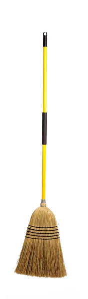 Yellow straw broom on white — Stock Photo, Image