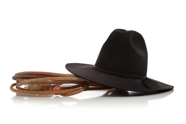 Black cowboy hat with lasso, lariat on white — Stock Photo, Image