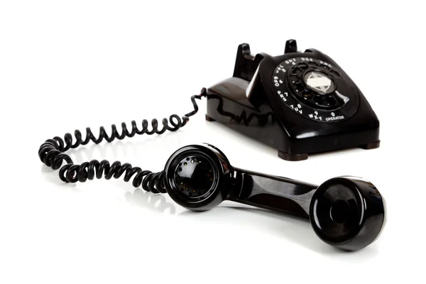 Um telefone preto vintage em um fundo branco — Fotografia de Stock